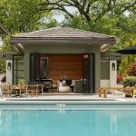 pool house ideas bifold glass doors allow for an extended entertaining area in this chic XZRLXTK