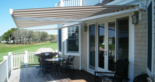retractable awnings cream and brown striped awning extended over residential deck area JYSHBAR