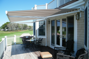 retractable awnings cream and brown striped awning extended over residential deck area JYSHBAR