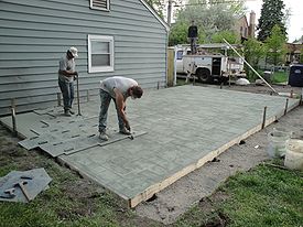 stamped concrete concrete being stamped with an ashlar slate pattern MAEZUBZ