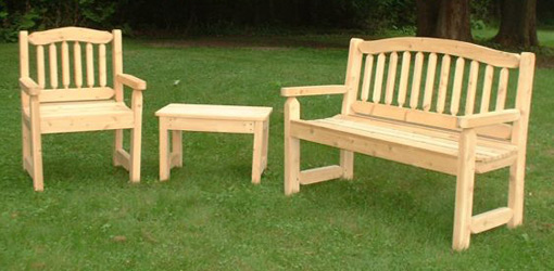 wood outdoor furniture cypress bench, chair, and table on lawn BFTHHOU