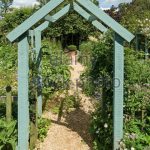 wooden garden arches green painted wooden arch arbour over garden path, barnsdale gardens,  oakham, AMKLXSX