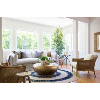 Using the round jute rug for
  better looking living rooms