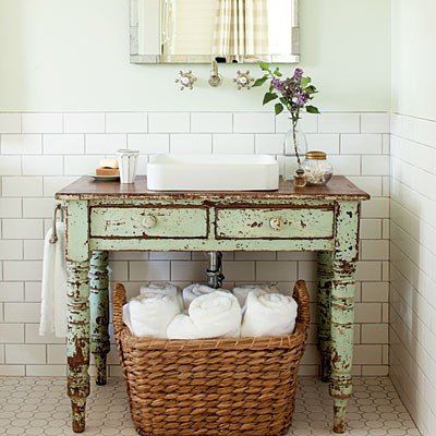 A vintage table is repurposed into a bathroom vanity - Unique