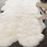 Obsessing over this white faux sheepskin rug that goes perfect in a