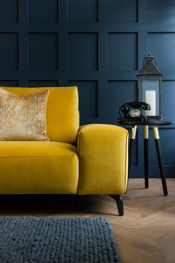 Luxury mustard yellow sofa perfect for dark moody living rooms