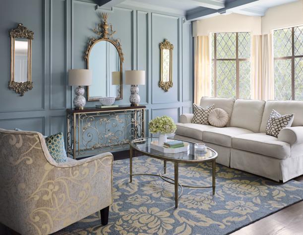 Utilize mirrors strategically to amplify light​ in your blue ​living room