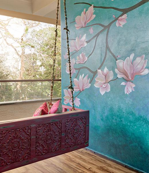 Transform walls with murals or outdoor art ​on your small balcony