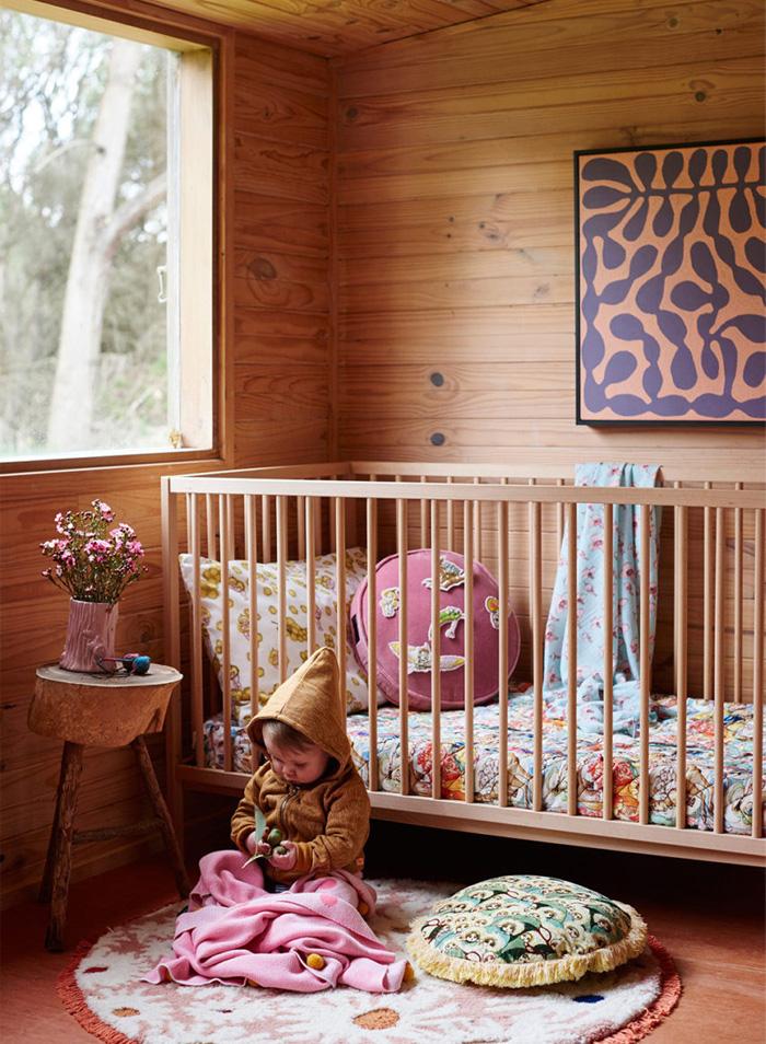 Cozy Cabin Nursery: Warmth of wood and nature-inspired decor create tranquility