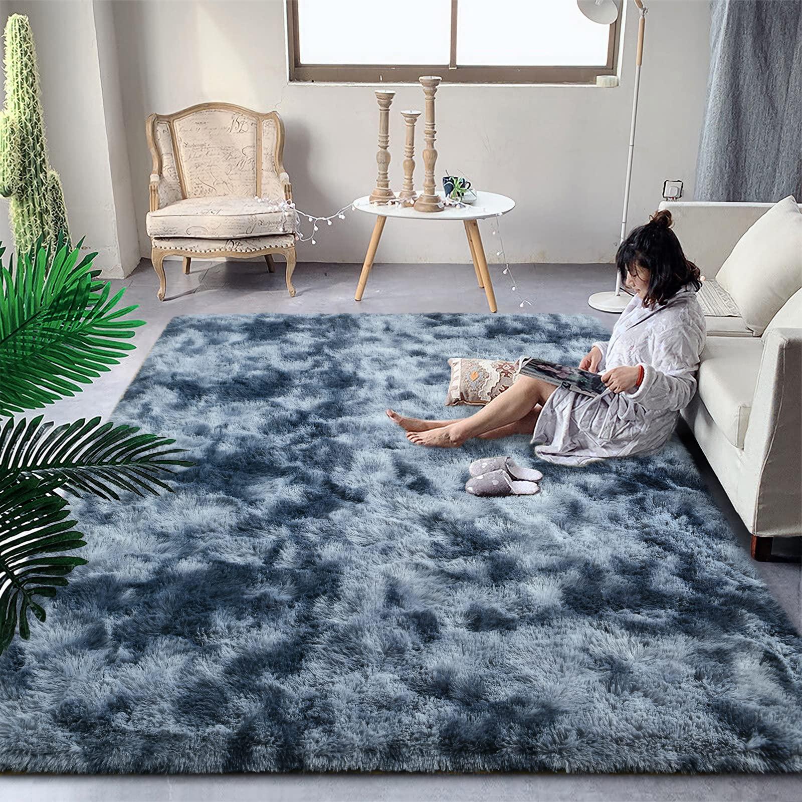 Incorporate plush rugs to add comfort to your blue ⁤living room