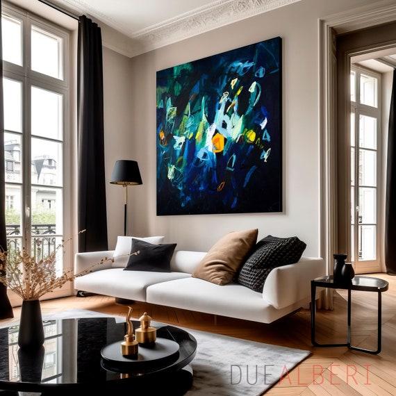 Bright artwork pops against a deep blue living room ⁣backdrop