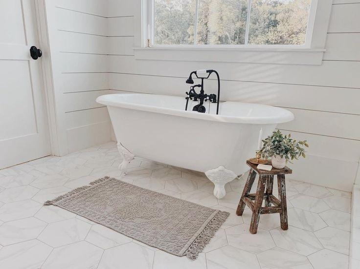 Add a wooden stool for ‌a rustic touch in your boho bathroom