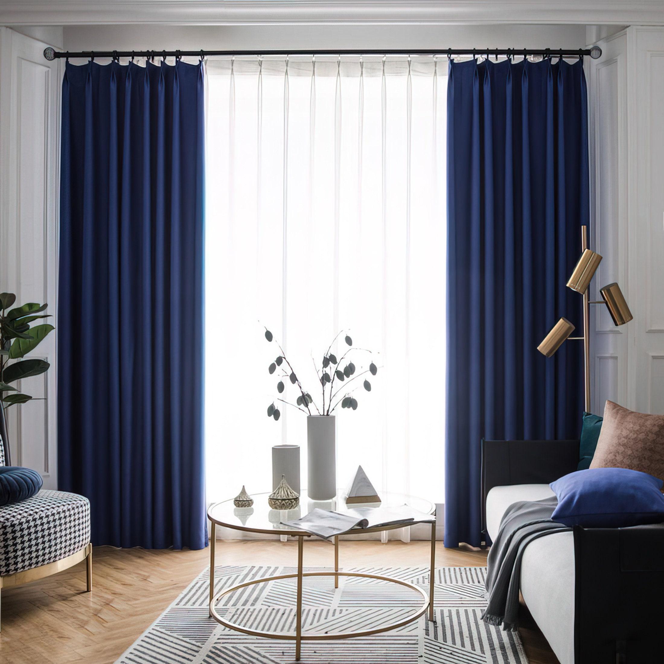 Stylish blue curtains soften⁤ the light in your living room