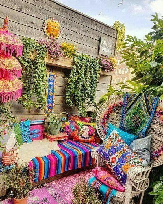 Colorful cushions can brighten up any small balcony seating area