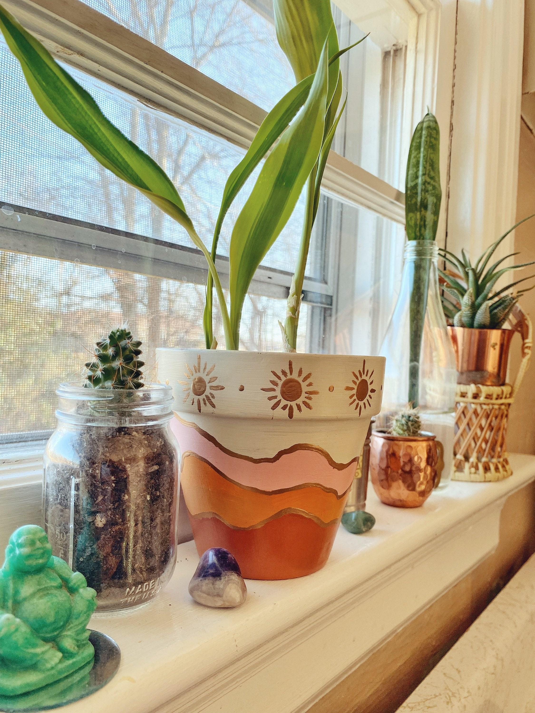 Terracotta pots to complement your ​boho bathroom theme