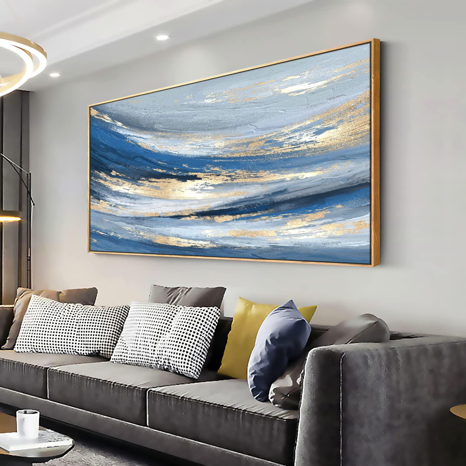 Incorporate blue wall art to enliven ​your blue living room