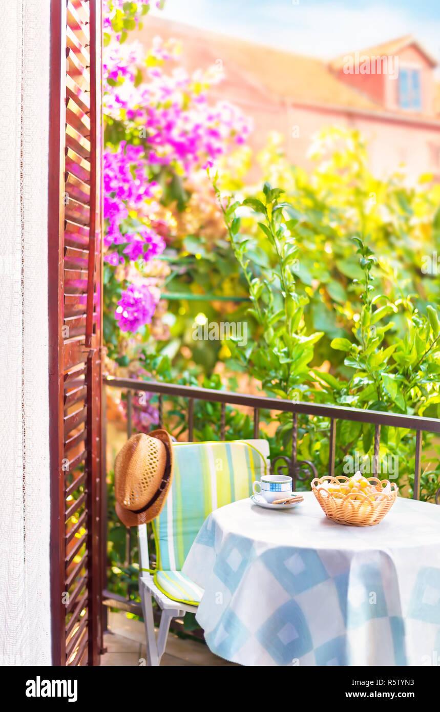 Install a small café table for coffee mornings on your small balcony