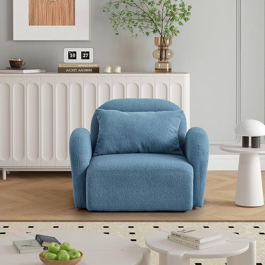 Incorporate ⁣a reading nook with a soft chair​ in your blue living room