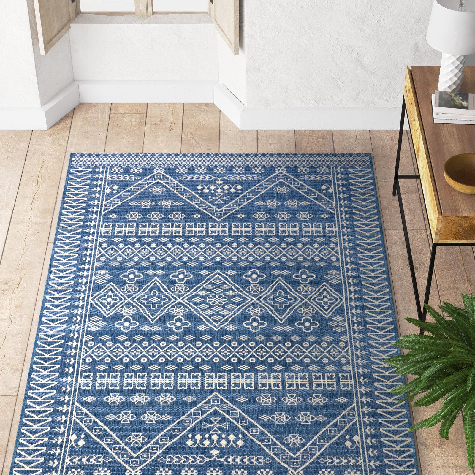 Choose a statement blue rug to anchor the space