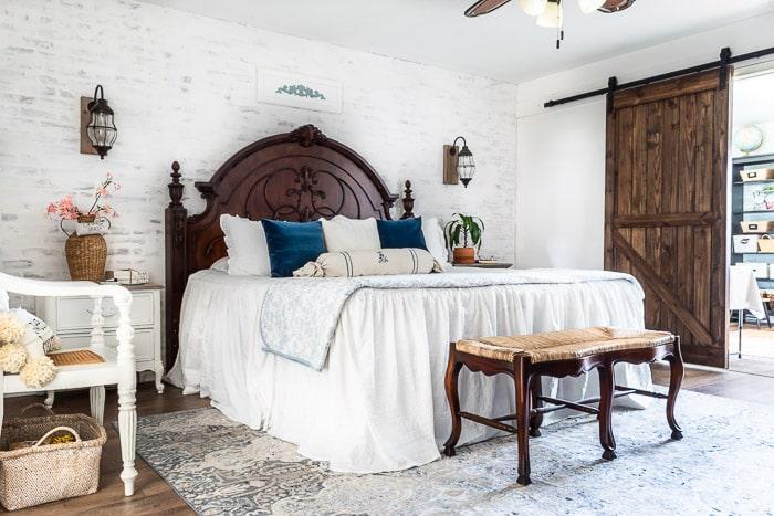 Rustic Farmhouse Bedroom with warm woods and cozy textiles