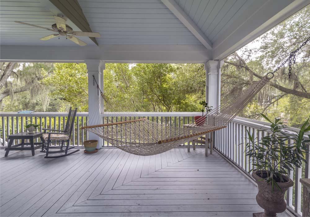 Add a hammock for relaxation in your Screened Porch paradise