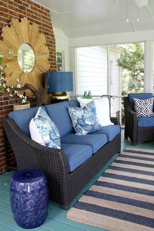 Add colorful cushions for comfort in your screened porch