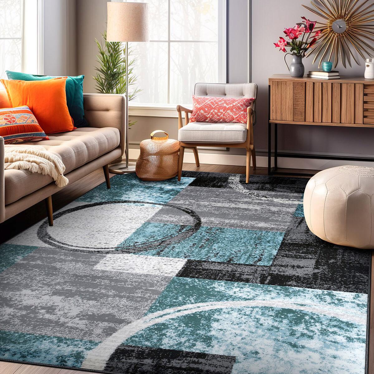 Create defined zones with area rugs in your contemporary living room setup