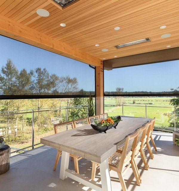 Incorporate sliding screens for easy access to fresh air on your screened porch