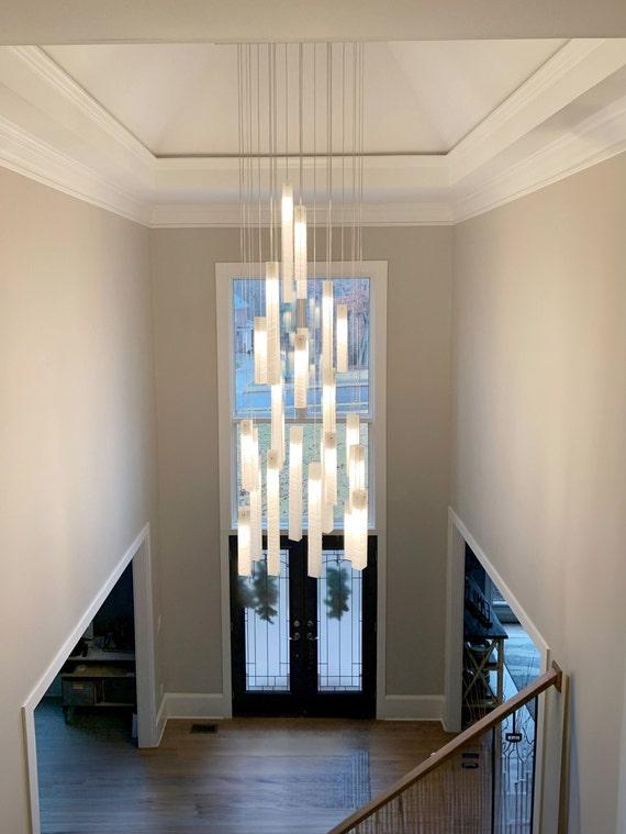 Add a statement chandelier to elevate the ambiance of your contemporary living room