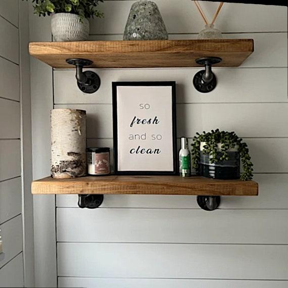 Feature open shelving for displaying towels and decor in your welcoming farmhouse bathroom