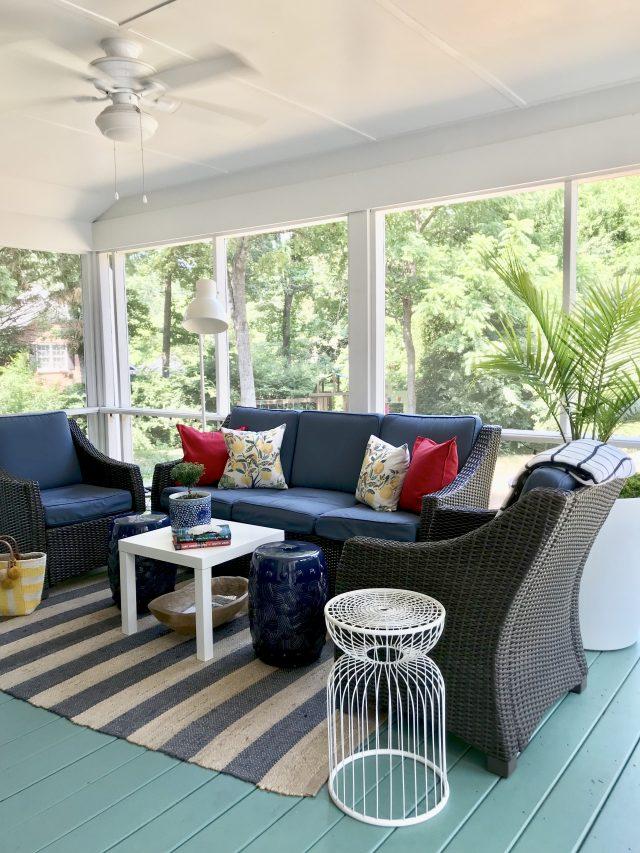 Incorporate ​outdoor rugs for added comfort and style on your Screened Porch