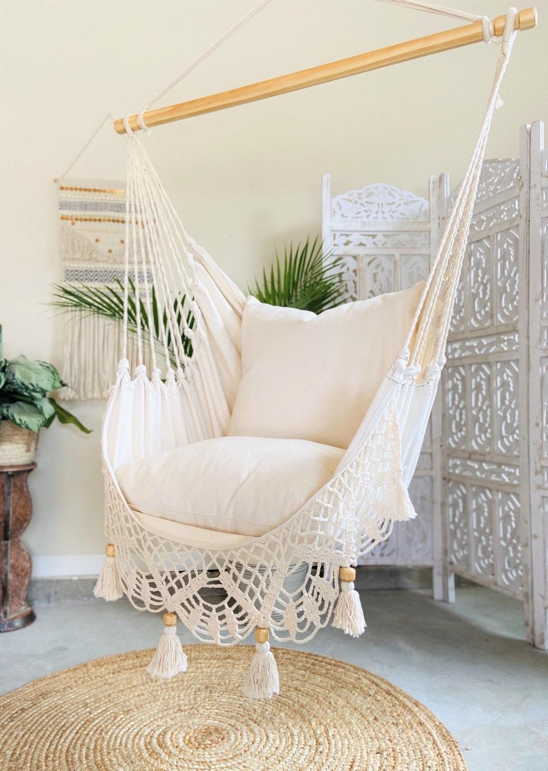 Create a reading nook with a hammock chair in your Boho Living Room