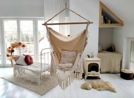 Create a reading nook with a hammock chair in your Boho Living Room