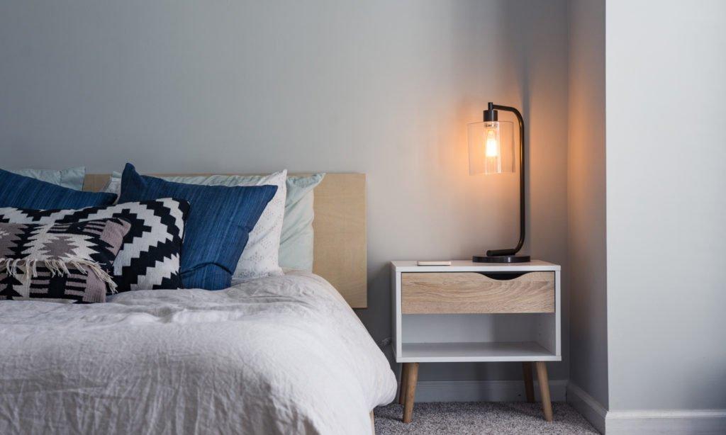 Limit electronics to reduce distractions in ‍your minimalist bedroom