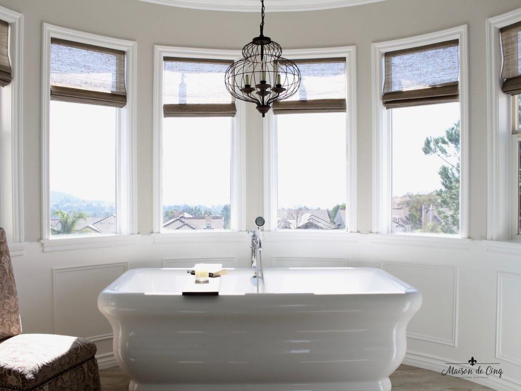 Use a freestanding tub to create a stunning focal point in your farmhouse bathroom