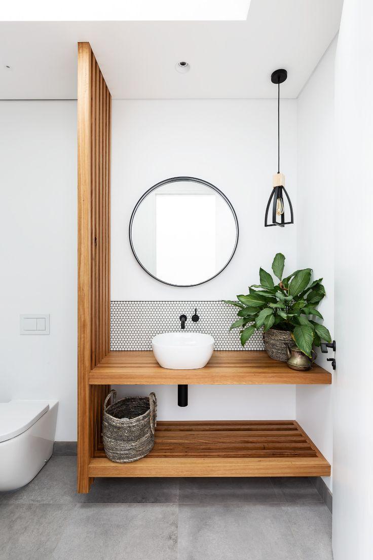 Use wood accents in fixtures for a cohesive look in your wooden bathroom