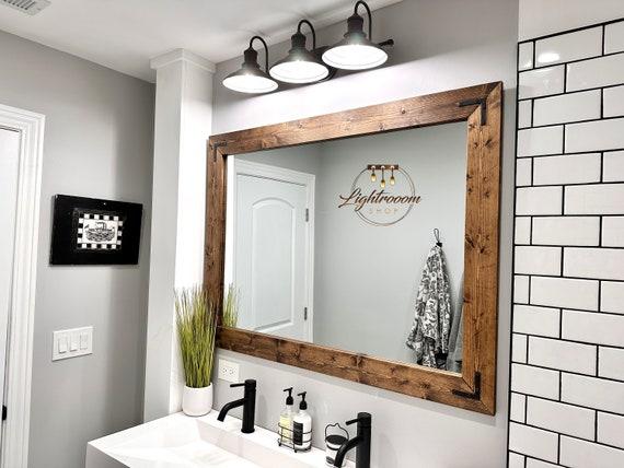 Use mirrors ​to reflect light in your Chalet Bathroom