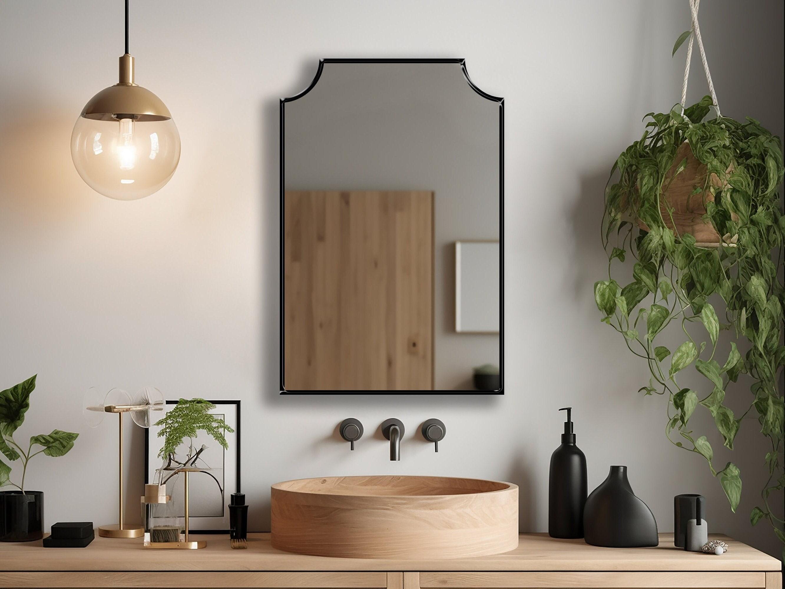 Create ⁤a statement mirror ⁤with a unique frame in your eclectic bathroom