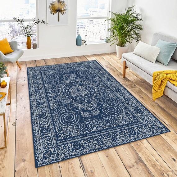 Use patterned rugs to introduce depth⁣ in your blue⁣ living ‌room