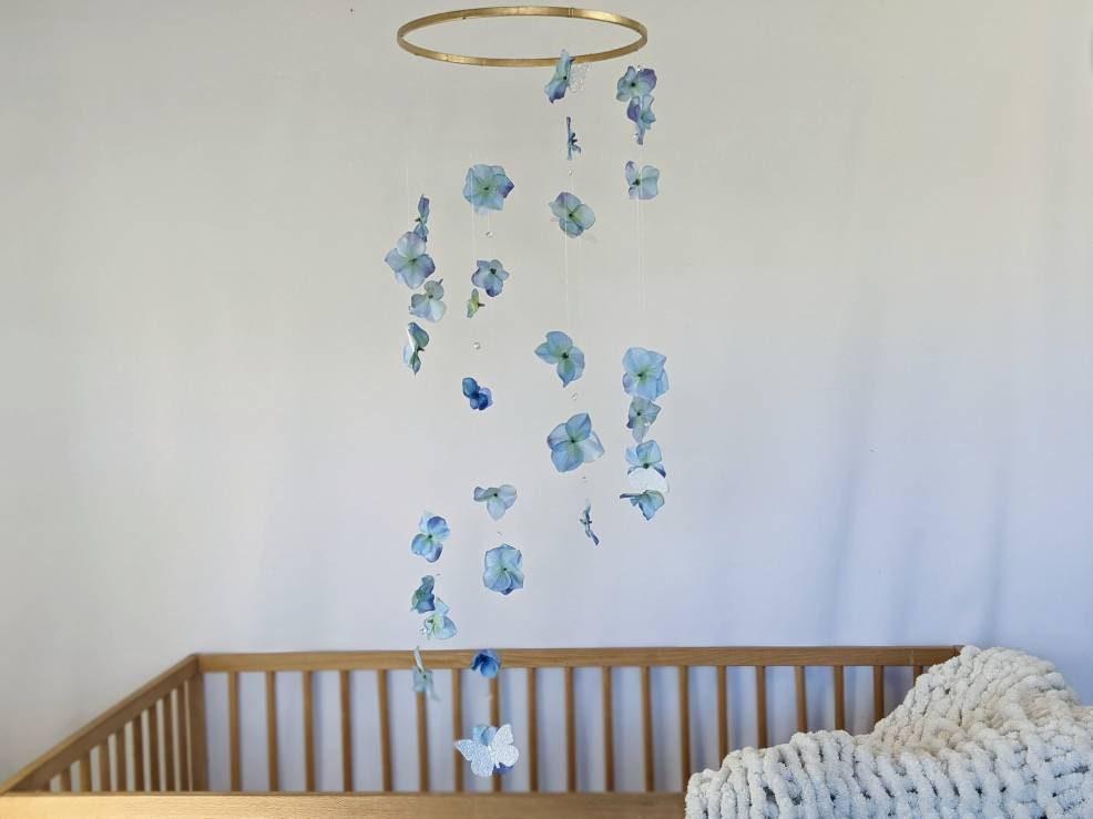 Add a ‍whimsical mobile above ⁣the crib for ⁢playful visual‍ interest in your Nursery‌ Nook