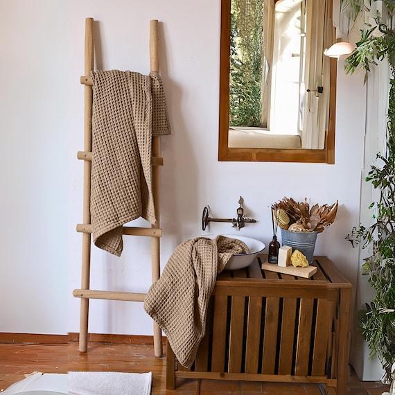 Accessorize with organic cotton towels for a sustainable boho bathroom