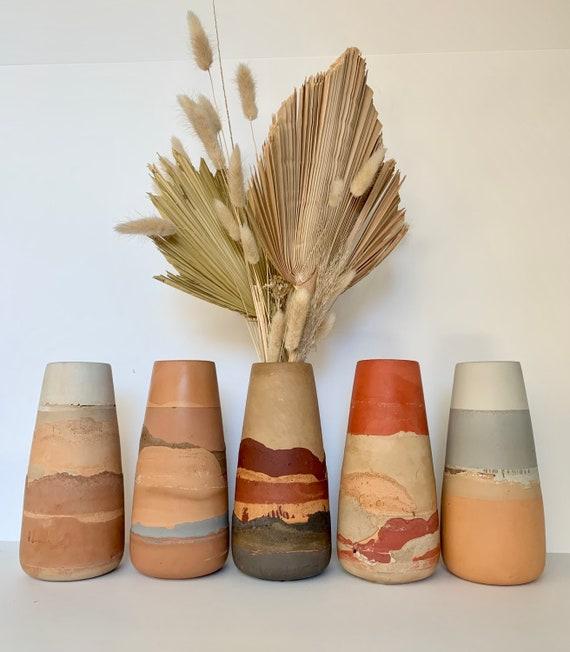 Decorate with handcrafted pottery for an artisan look in your Boho Living Room