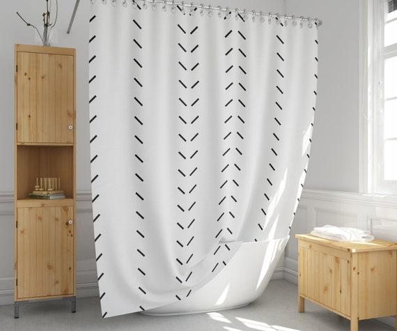 Use natural fibers in curtains for a breezy boho bathroom feel