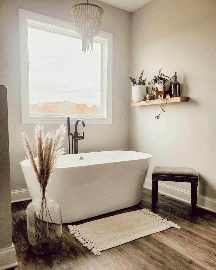 Create a cozy nook with a freestanding tub in your boho bathroom