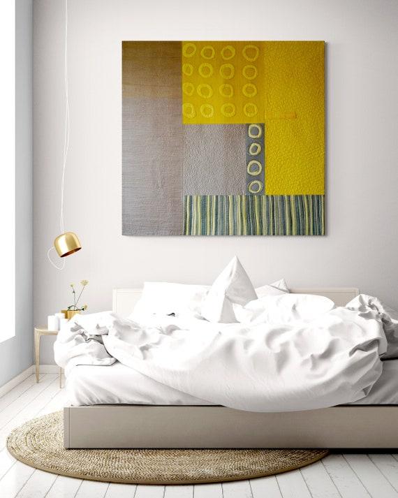 Add a ‌single statement piece of art in your minimalist bedroom