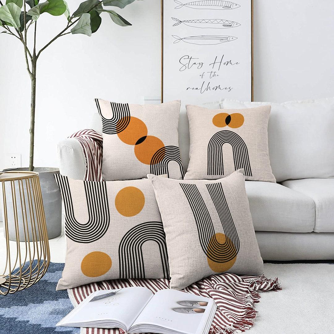 Experiment with geometric patterns in cushions or decor for a dynamic contemporary living room