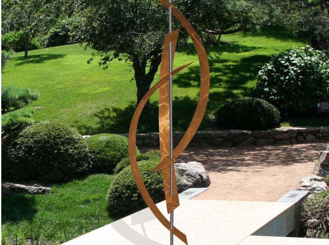 Incorporate sculptures for artistic flair in your backyard