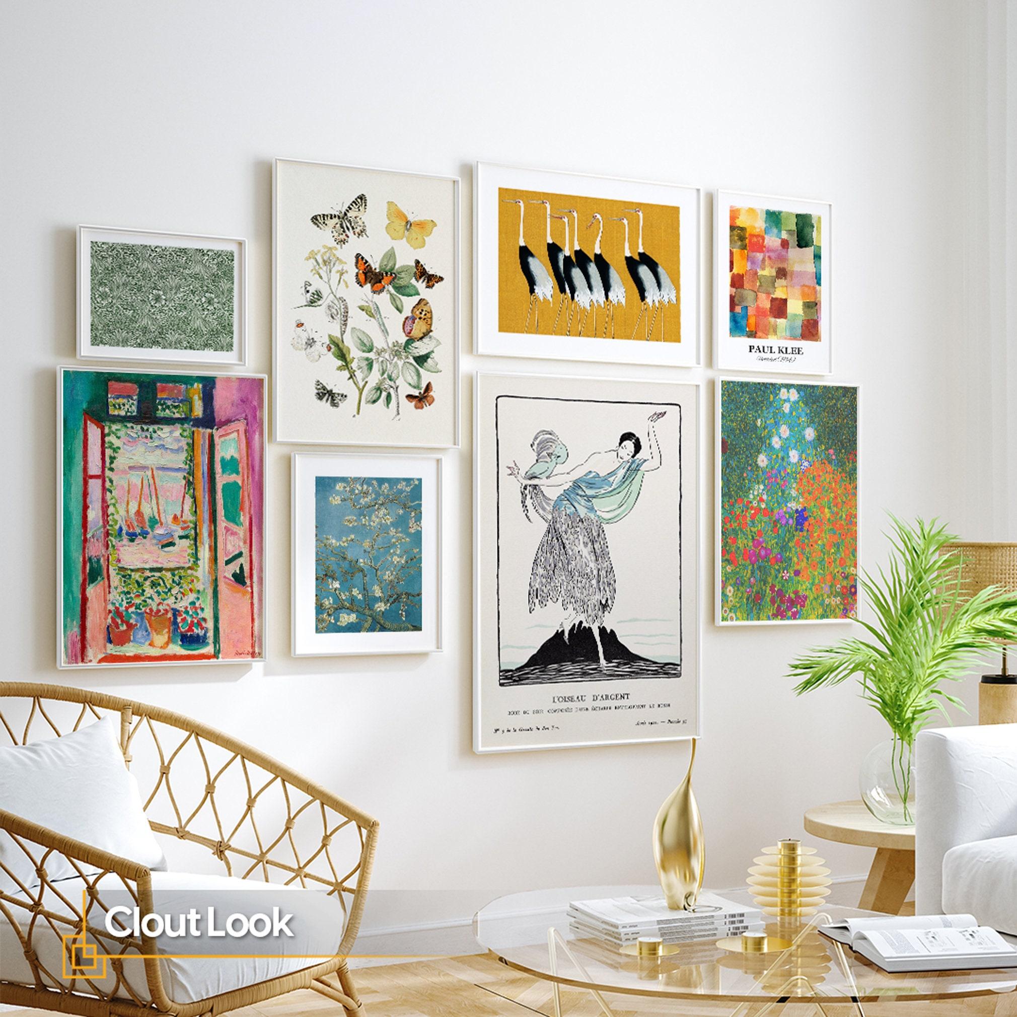 Hang a gallery wall of framed photographs to personalize your eclectic living room