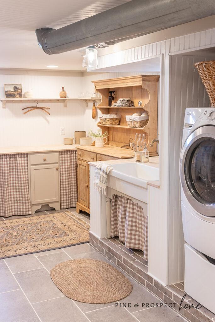 Design a small but functional laundry area within your farmhouse bathroom space