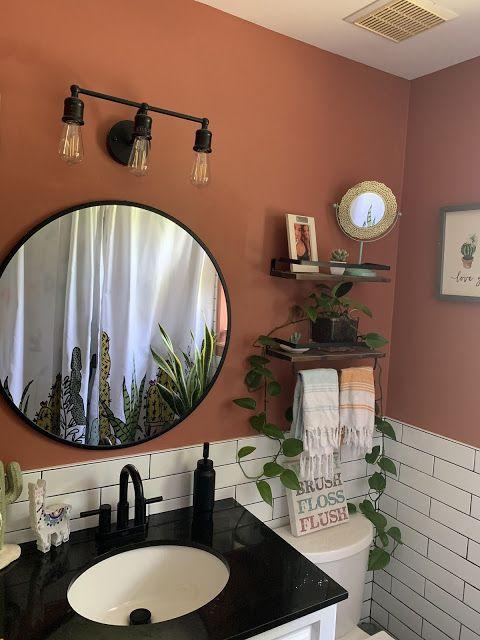 Earthy, terracotta tiles to ground your boho bathroom oasis